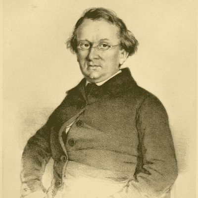 Eduard Mörike hat lockiges Haar und trägt eine Brille.